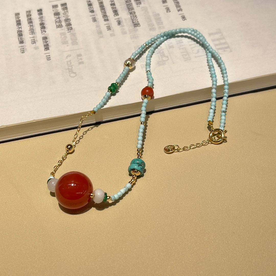 Fashionable turquoise and reddish red necklace