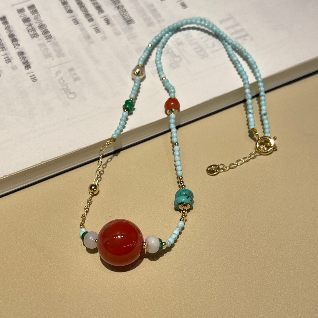 Fashionable turquoise and reddish red necklace