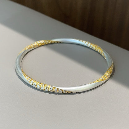 Fashionable gold-painted wrap-around sterling silver bracelet