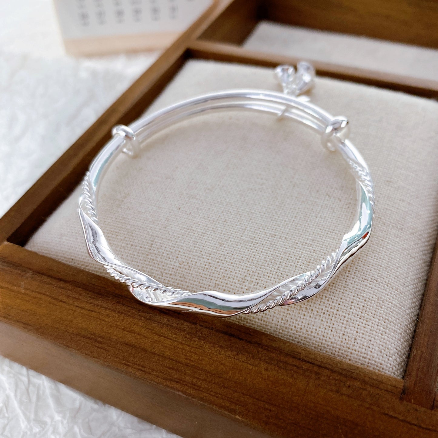 Wrapped bell sterling silver bracelet