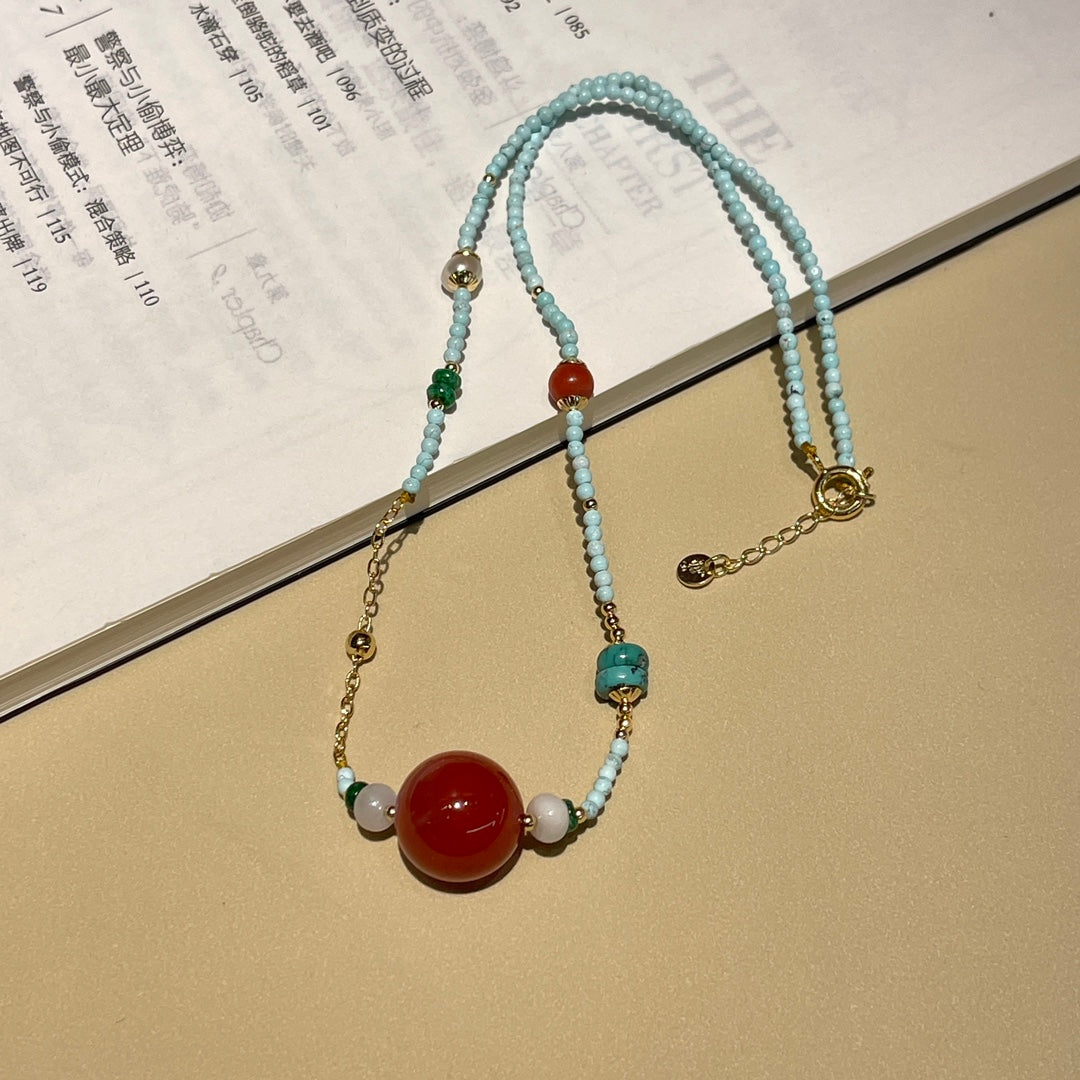 Fashionable turquoise and reddish red necklace