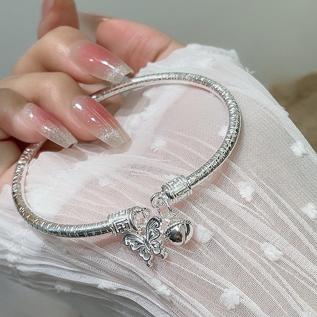 China round stick hanging bell butterfly sterling silver bracelet