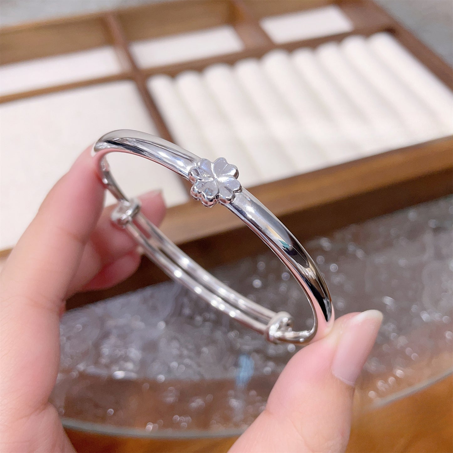 Polished four-leaf clover sterling silver bracelet