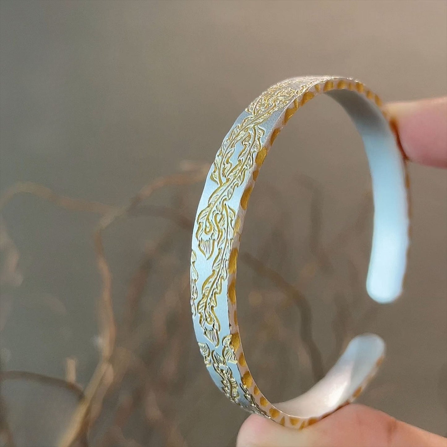 Gold painted phoenix feather side hammered silver bracelet