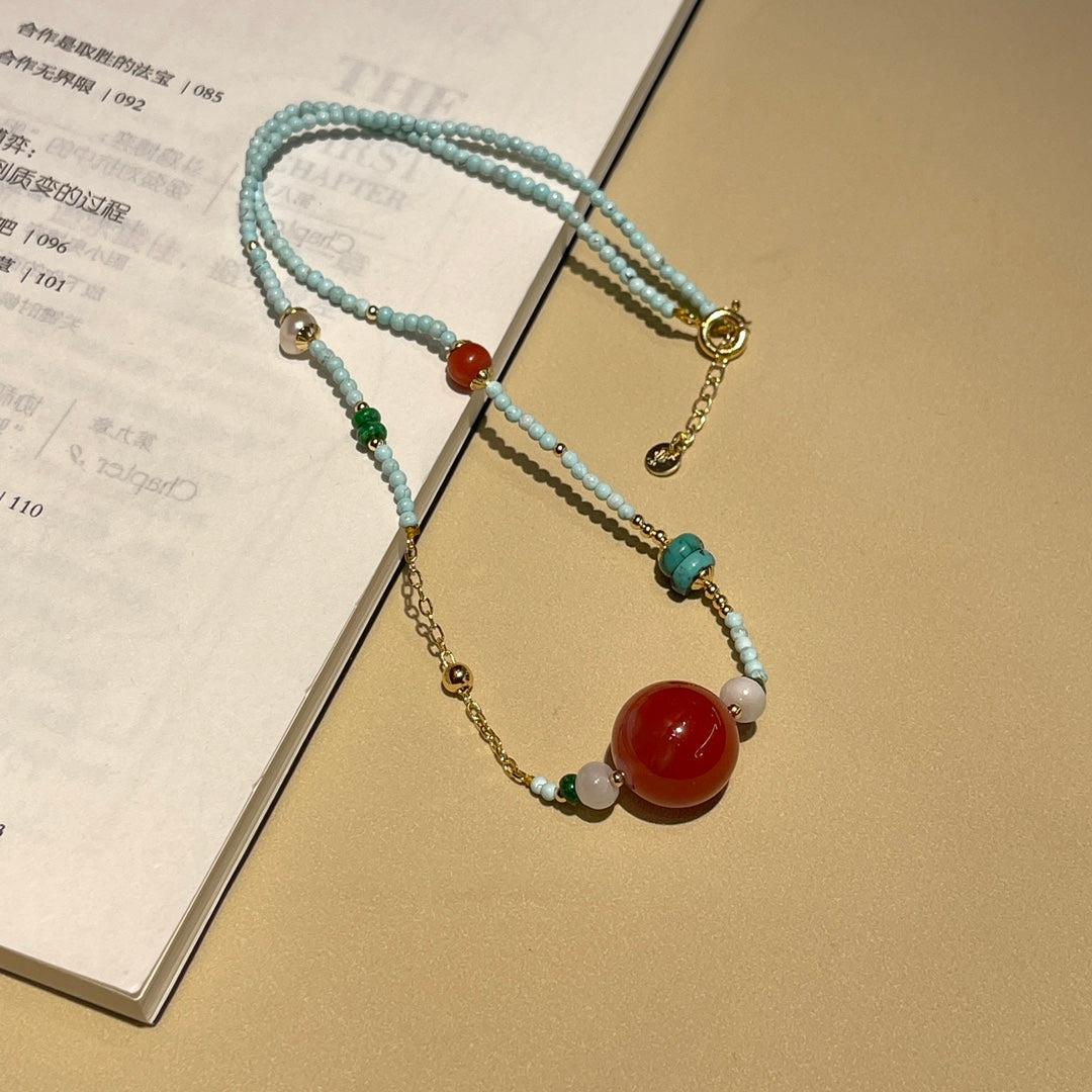 Fashionable turquoise and reddish red necklace